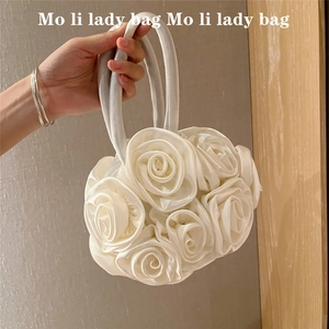 Close-up of white handmade fabric rose floral round handbag for Hanfu and Cheongsam