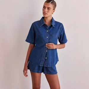 Women's vintage washed dark blue denim set featuring short sleeve shirt and matching shorts