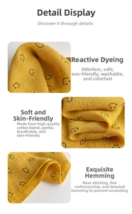 Detail of ginger cotton baby bandana featuring soft smile print and premium lockstitching