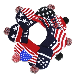 Winter knit beanies with American flag stars and USA pattern with decorative pom poms
