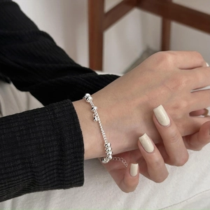 Minimalist 925 sterling silver beaded bracelet with adjustable chain on female wrist