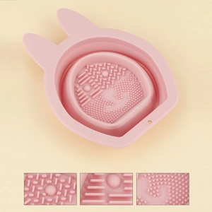 Macro detail of textured pink rabbit silicone cleaning bowl with various scrub patterns