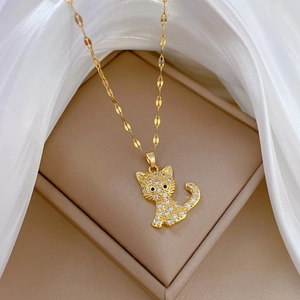 Luxurious gold cat pendant necklace with sparkling crystals in an elegant jewelry box