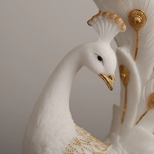 Minimalist white resin peacock vase with gold accents and feather texture details