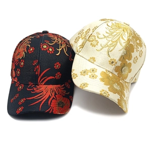 Floral embroidery baseball cap in black and cream featuring traditional jacquard patterns