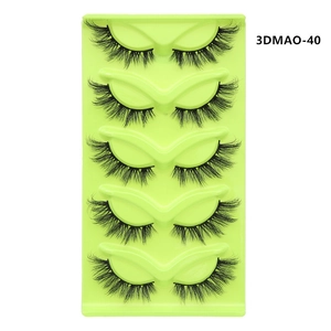 Detailed close-up of five pairs of black criss-cross long cat-eye false eyelashes