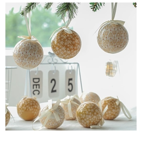 Champagne gold and cream white Christmas tree balls with snowflake patterns and ribbons