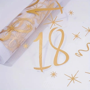 White mesh table runner with gold number 18 and stars for birthday party decoration