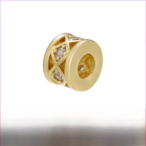 Macro shot of 18K gold plated brass charm with rhombus hollow pattern and zircon inlay