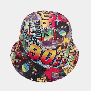 Detail of 90s retro graffiti print on wide brim bucket hat featuring vintage boombox patterns