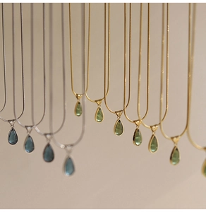French vintage waterdrop pendant necklaces in gold and silver with blue and green stones