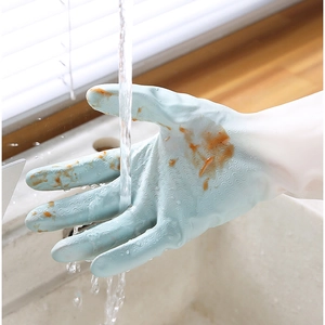 Waterproof blue household cleaning gloves with non-slip texture washing stains in kitchen sink