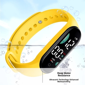 Waterproof yellow LED sports watch submerged in water with dynamic air bubbles