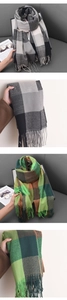 Detail of British style checkered cashmere-like scarf showing fringe and woven texture