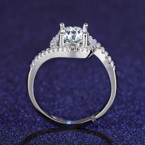 Close-up of six-prong zircon wedding ring with halo setting and asymmetric diamond band
