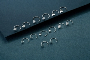 Detailed collection of minimalist 999 sterling silver hoop earrings with diverse charms