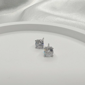 Macro detail of round cubic zirconia stud earrings in a S925 sterling silver claw setting