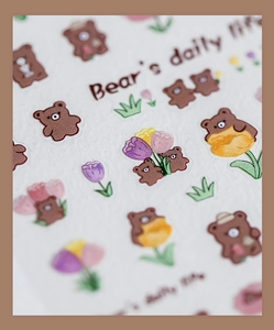 Macro detail of Bear's Daily Life nail stickers with brown bears and colorful tulips