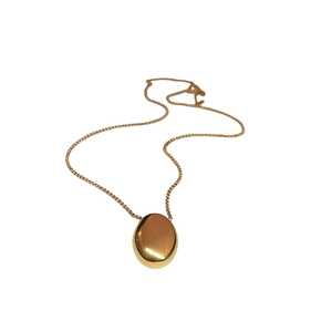 Polished gold geometric oval pendant necklace with a fine metallic chain for women