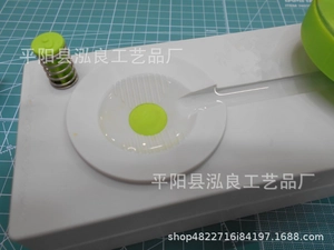 Detail view of a manual paint brush cleaner tool with spring mechanism and plastic components