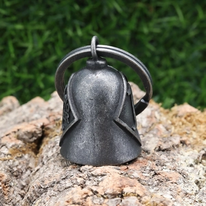 Macro shot of retro motorcycle guardian bell with vintage silver finish on wood