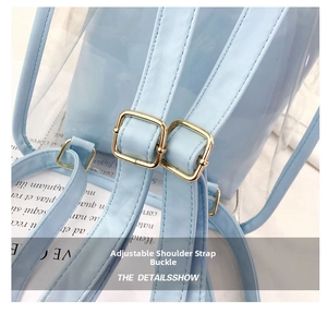 Detail of adjustable golden metal buckles on the light blue clear PVC backpack strap