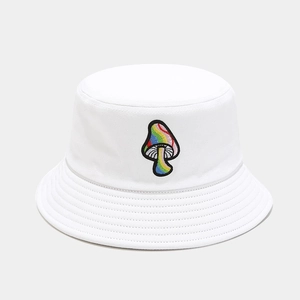 Detailed close-up of rainbow mushroom embroidery on a white cotton bucket hat