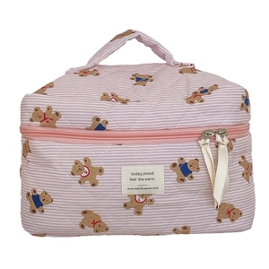 Pink striped quilted teddy bear cosmetic bag with handle and dual zipper on white background