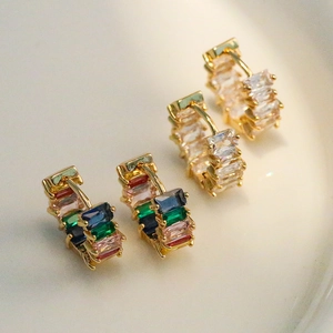 Gold-plated hoop earrings featuring baguette-cut rainbow and clear cubic zirconia stones