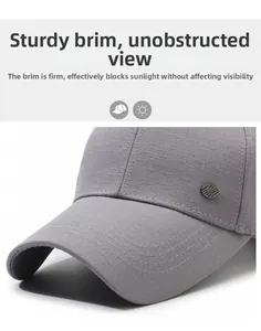 Detail of grey baseball cap showing reinforced brim and textured woven fabric with badge