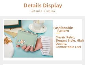 Close-up of light green trifold wallet with cute corgi print and metal snap closure