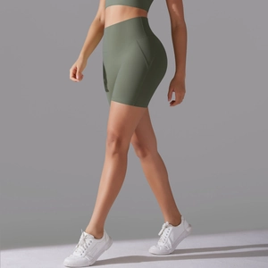 Detail view of olive green high waisted yoga shorts featuring seamless butt lifting design