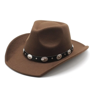 Detail of a brown felt cowboy hat featuring a black leather band with silver metal studs