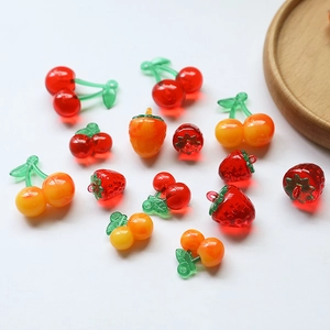 DIY colorful resin fruit pendants including strawberries and cherries for jewelry making