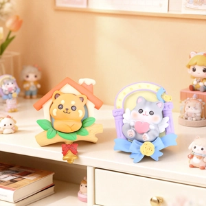 Close-up of cute resin animal figures featuring a puppy clock and winged cat on a white shelf