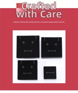 Set of four black velvet jewelry display pads with functional white alignment markings