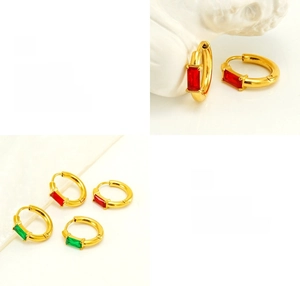 Detail of gold-plated square zircon earrings with emerald and ruby step-cut stones
