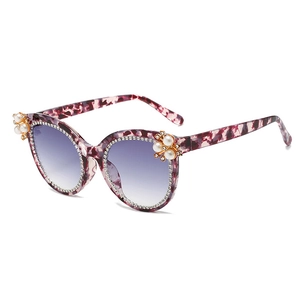 Cat eye pearl sunglasses with crystal rhinestones and purple tortoise shell frame