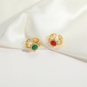 Minimalist adjustable gold chain rings featuring set green and red resin gemstones