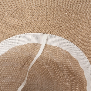 Detail shot of breathable straw hat interior with adjustable white mesh sweatband and drawstring