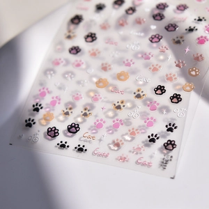 Detailed view of 3D embossed nail stickers featuring cute colorful cat paws and stars