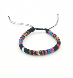 Detail of colorful handmade woven bohemian bracelet with adjustable sliding knot closure