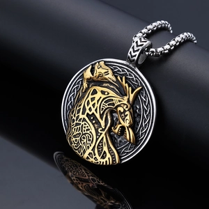 Nordic Viking wolf head pendant necklace in gold and silver contrast on black stand