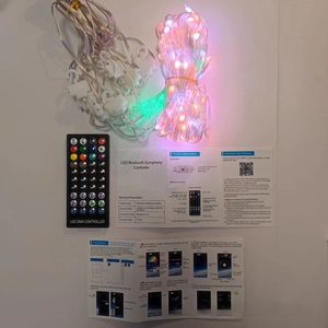 Detail view of RGB LED fairy string light set with 40-key remote and user manuals
