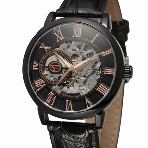 Detailed macro shot of a black mechanical skeleton watch dial with rose gold Roman numerals