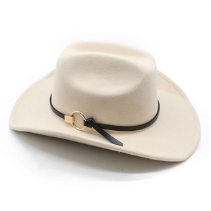 Detail of cream felt cowboy hat with black leather band and golden ring buckle