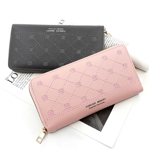 Close-up of long zip-around wallets in pink and grey PU leather with crown embroidery