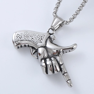 Macro detail of vintage silver gesture gun pendant with stainless steel box chain
