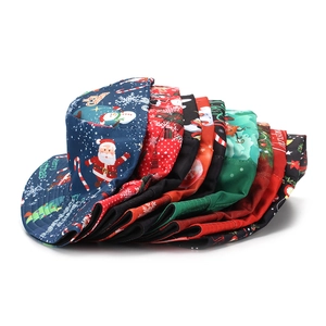 Stack of colorful Christmas bucket hats with Santa and snowman prints for outdoors