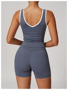 Rear view of racerback sports vest with contrast white trim and high-waist shorts